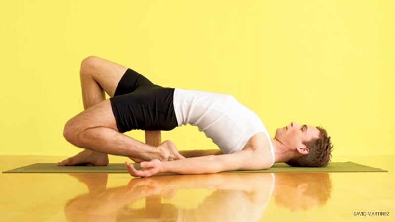 MASTER_189_08-credit Eka Pada Supta Virasana one-legged hero pose with block assist, Eka Pada Supta Virasana