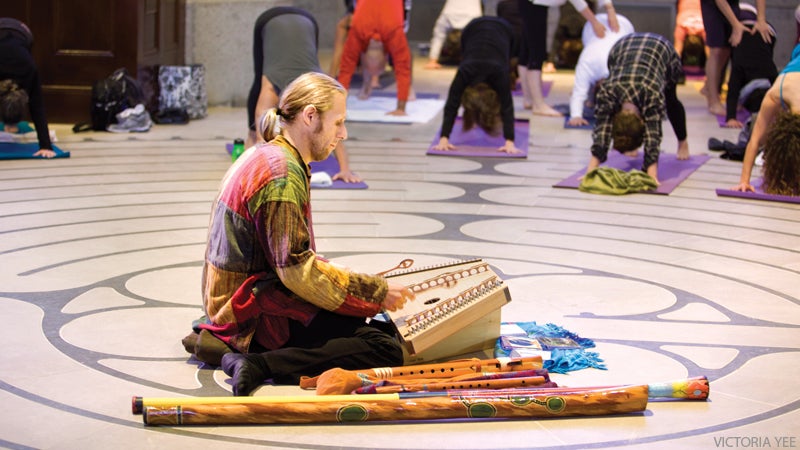 Kirtan man playing for yoga class Kirtan man playing for yoga class