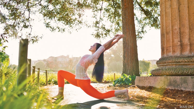 woman doing yoga outside kneeling crescent backbend pose woman doing yoga outside kneeling crescent backbend pose