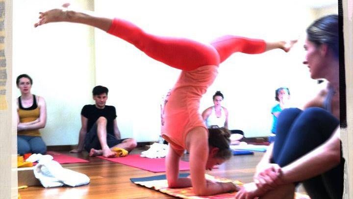 Catching a Studio's Attention kathryn budig hanumanasana in pincha mayurasana