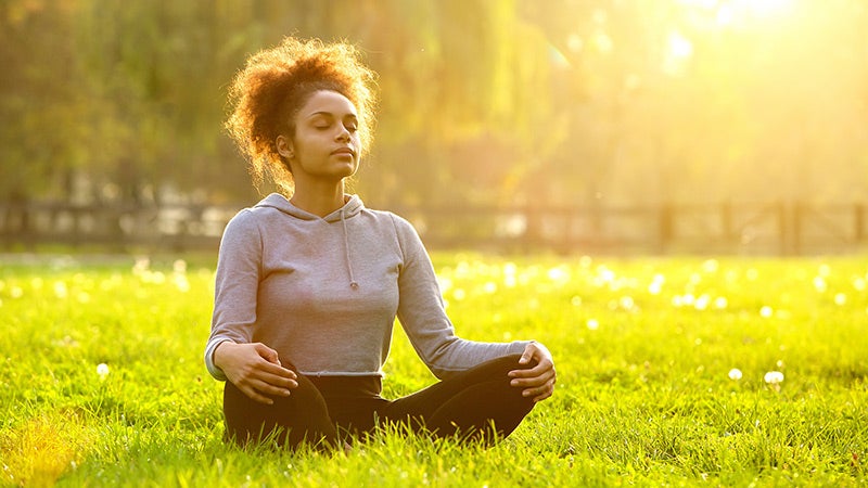woman meditating outside woman breathing meditation outside