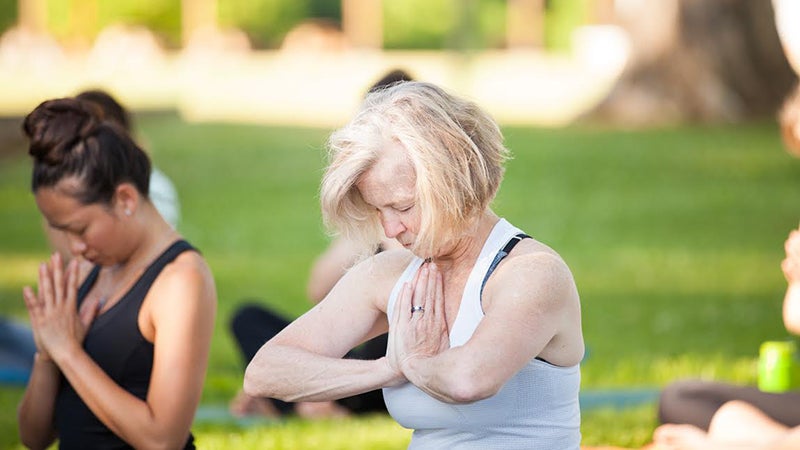blog-post-2-image-older-woman-anjali-mudra yoga for menopause