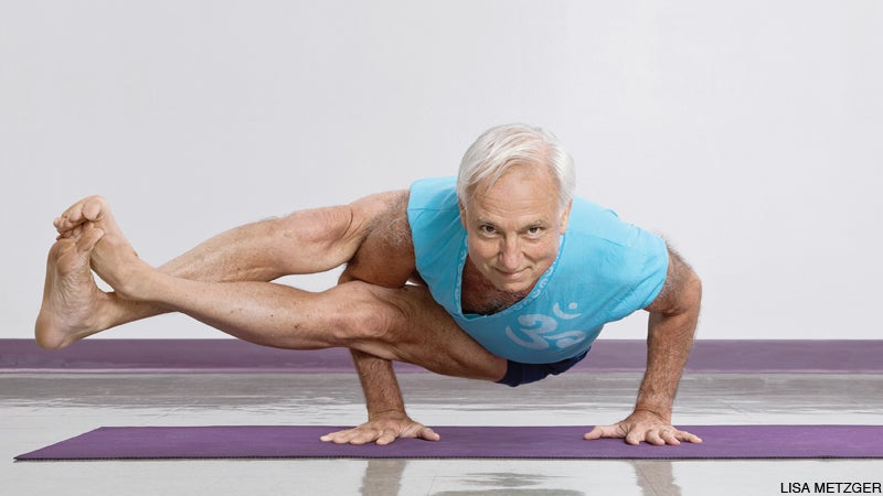 older man mature yogi arm balance astavakrasana eight angle pose older man mature yogi arm balance astavakrasana eight angle pose