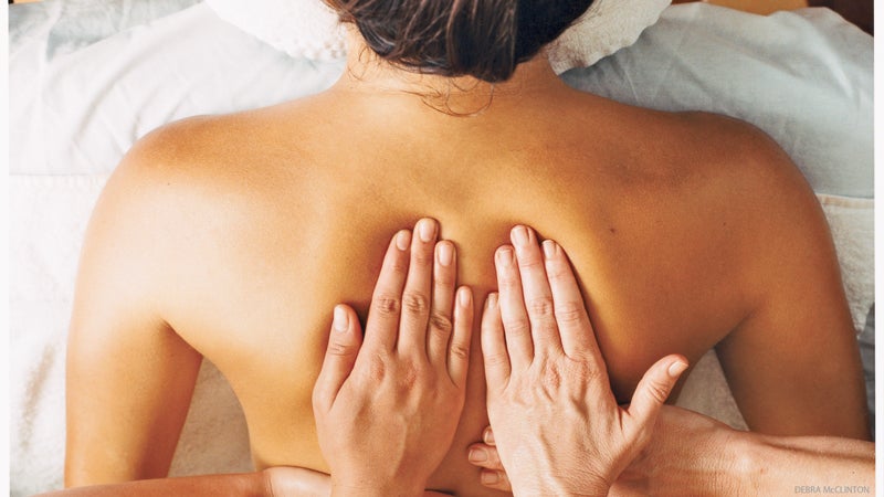 woman gets back massage for emotional and physical tension woman gets back massage for emotional and physical tension