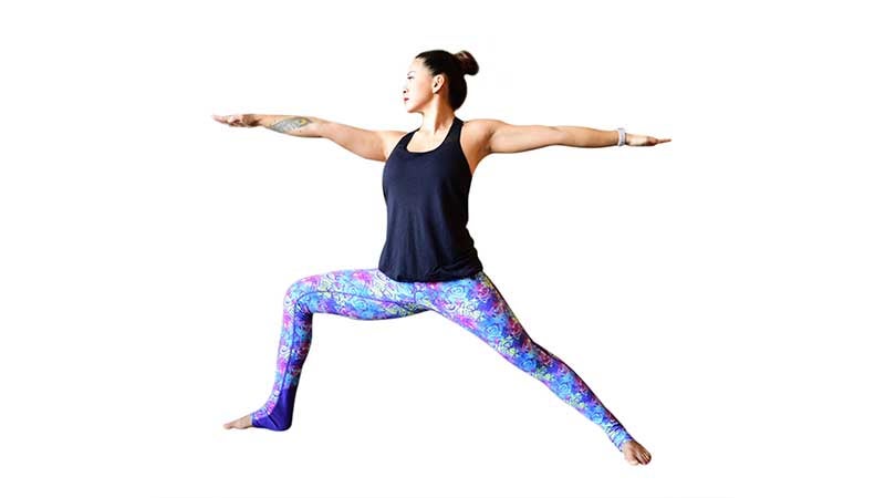 Two Fit Moms perform Warrior II lunges. Two Fit Moms perform Warrior II lunges.