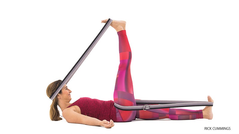 YJ-0121_FNL reclining hand to big toe pose with strap assist, supta padangusthasana