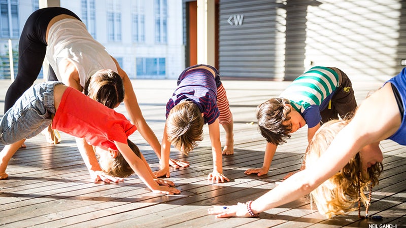 Leah Cullis and friends demonstrate Downward-Facing Dog. Leah Cullis and friends demonstrate Downward-Facing Dog.