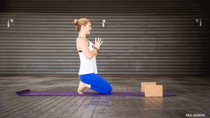 Leah Cullis performs Fire Toes. Leah Cullis performs Fire Toes pose