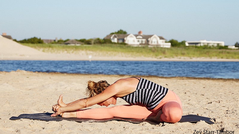Colleen Saidman Yee performs Head-to-Knee Forward Bend.