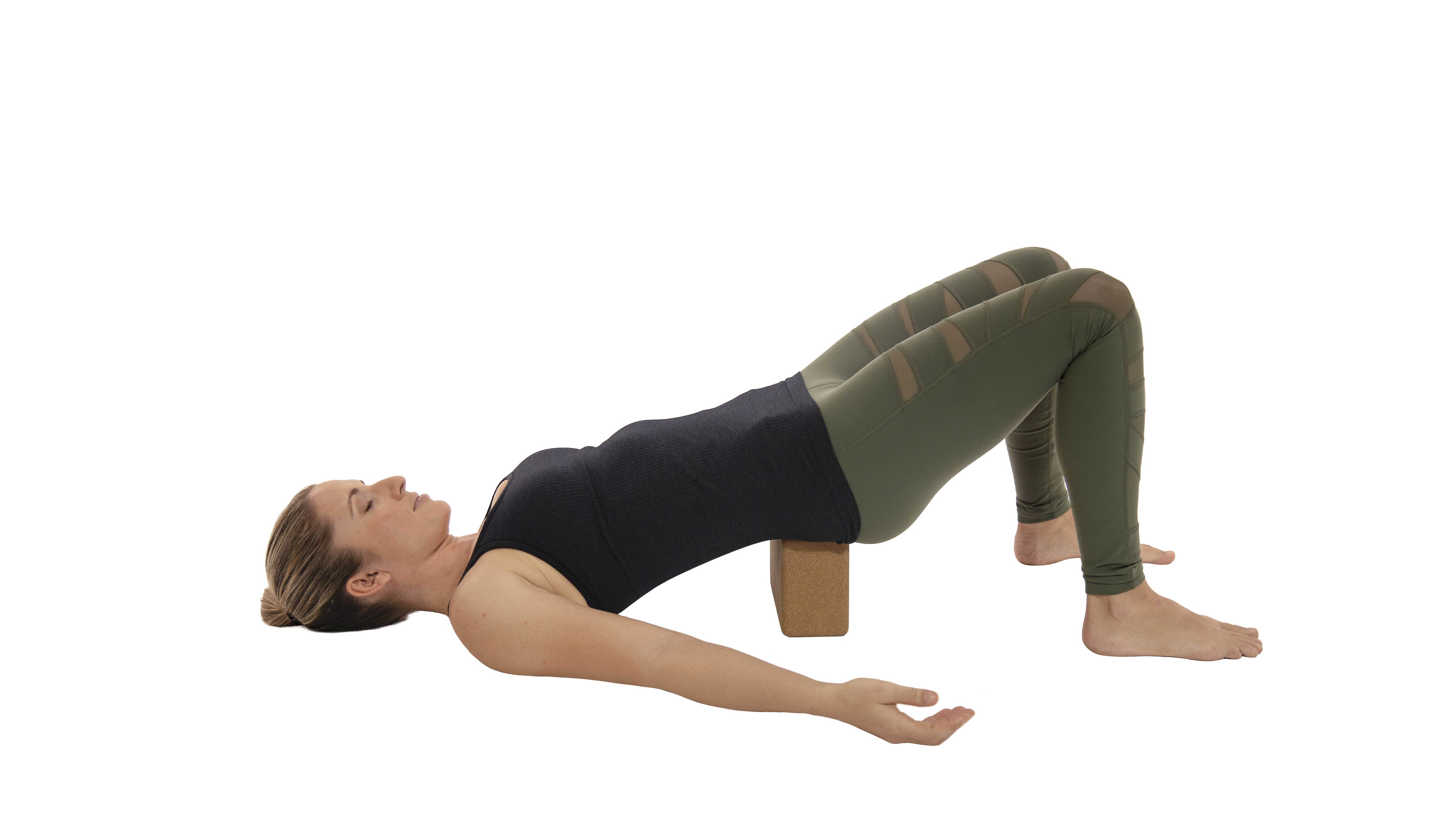 Setu-Bandha-
Sarvangasana woman practicing setu banda sarvangasana or bridge pose