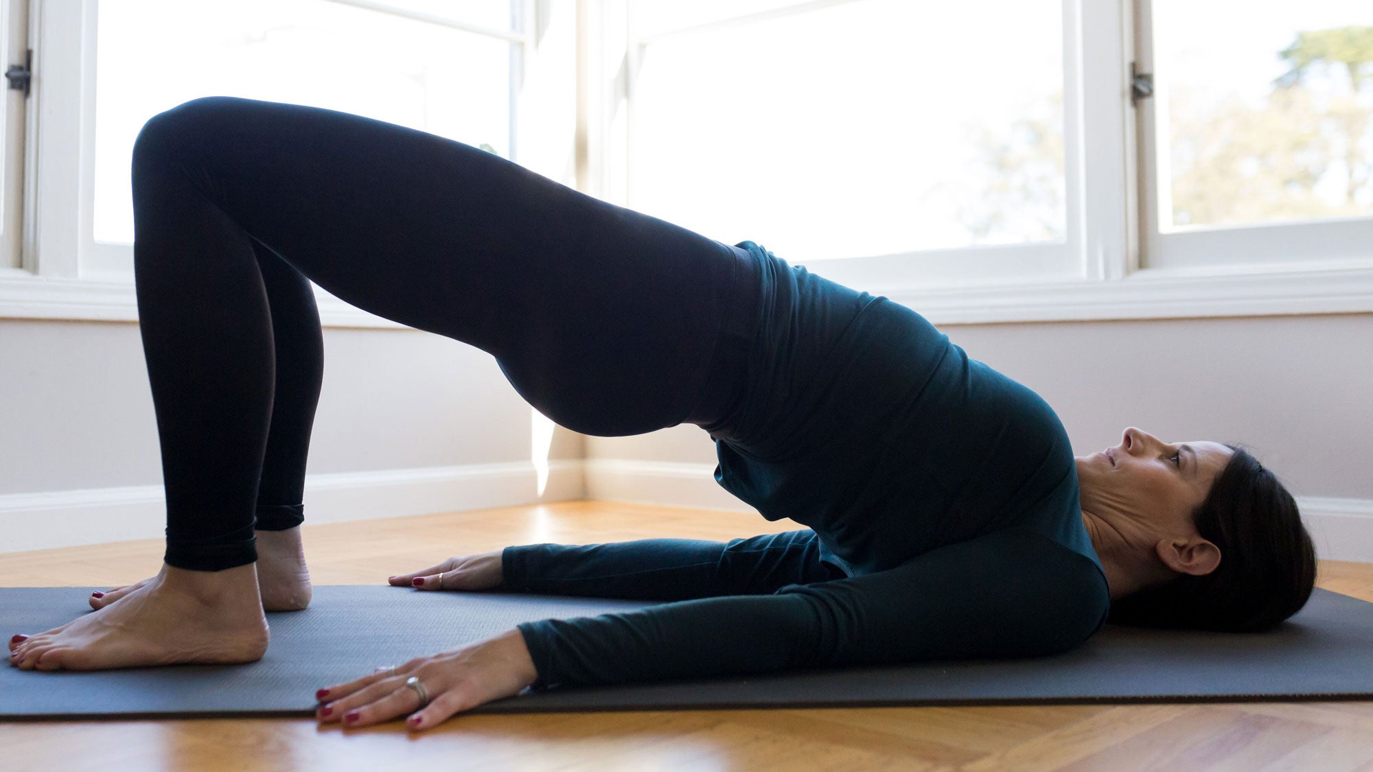 bridge-pose Yoga after miscarriage. Bridge pose, variation.