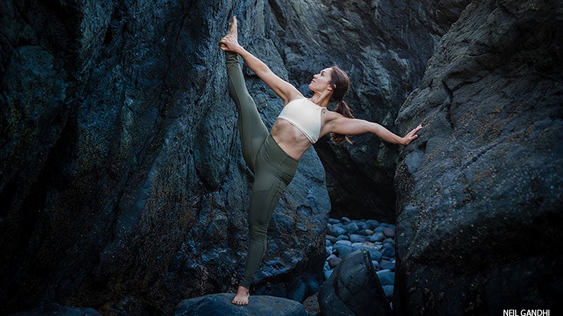 From Down Dog, step your left foot between your hands, moving into Warrior Pose II. Then, straighten your front leg and on an exhale, reach your left arm forward, extending your torso to the left. Raise your right arm skyward and move your gaze toward your top thumb. Stay here for 5 deep breaths, silently repeating: ”I am grounded.” Move through a vinyasa; repeat on the other side. Then move through another vinyasa, and finish lying face-down on your mat.See also YJ’s Mission to Help Make Yoga More Inclusive for All