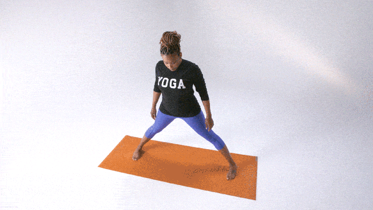 Woman demonstrates Wide-Legged Standing Forward Bend