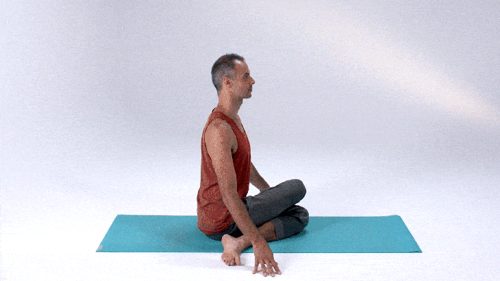 Man demonstrates Half Lord of the Fishes Pose