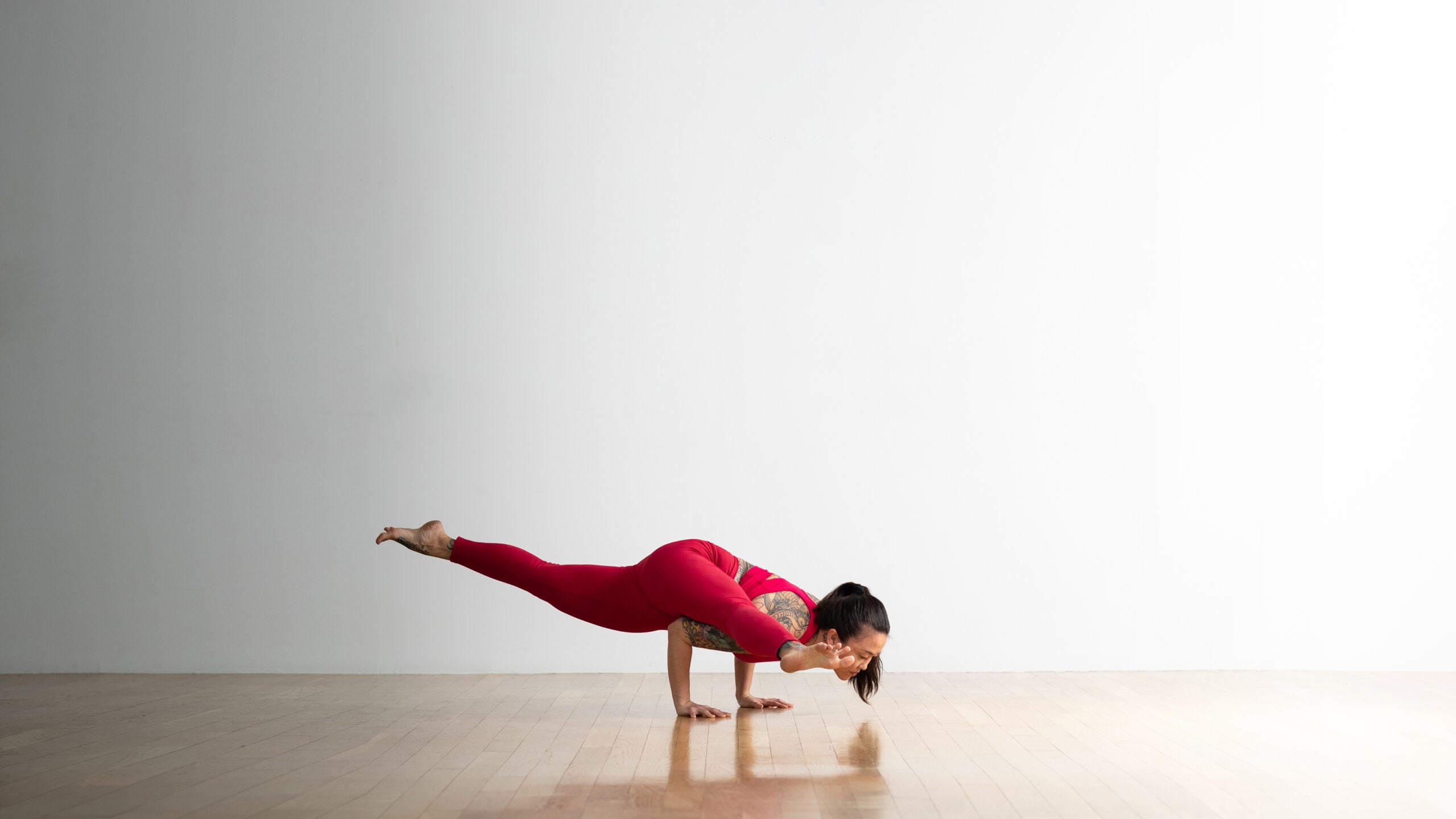 Soozie Kinstler practices Koundinyasana.