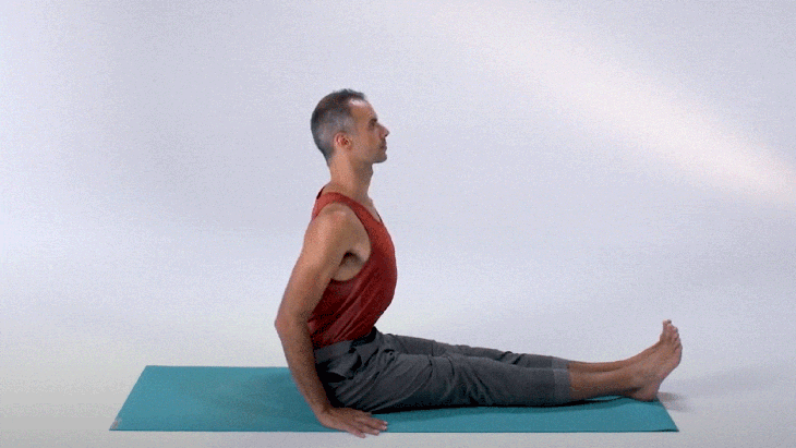A person demonstrates Boat Pose (Navasana) in a moving image