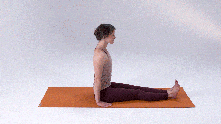 Woman demonstrates Pose Dedicated to the Sage Marichi 1 (Marichyasana I)