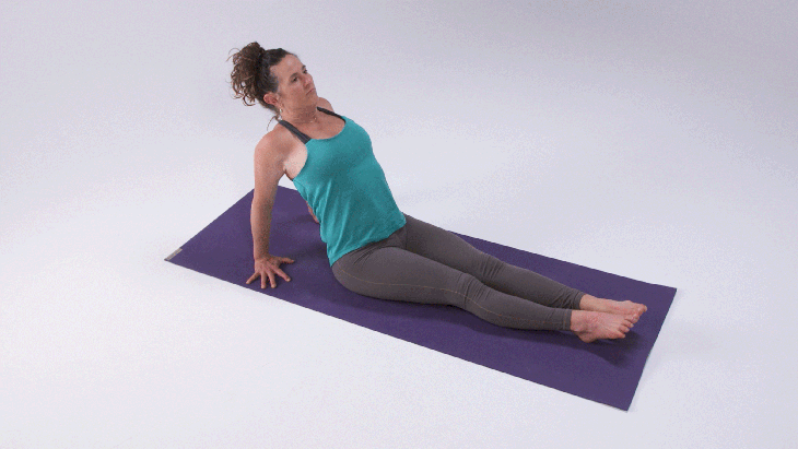 A woman demonstrates how to come into Reverse Plank Pose or Upward Plank Pose
