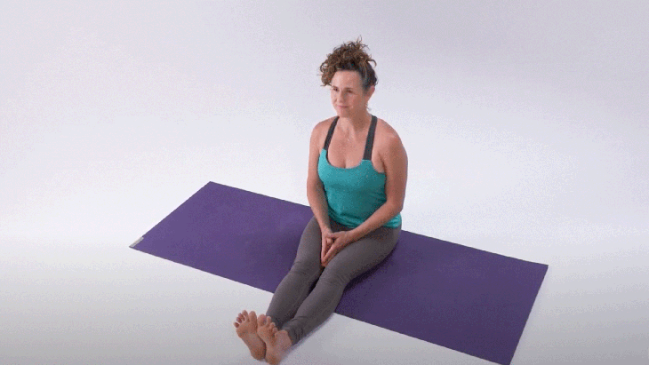 Woman demonstrates Sukhasana-Easy Seat