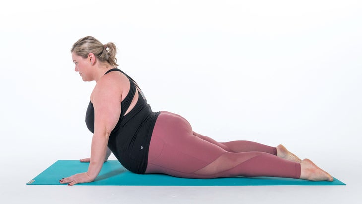 Woman demonstrates a variation of Upward-Facing Dog Pose