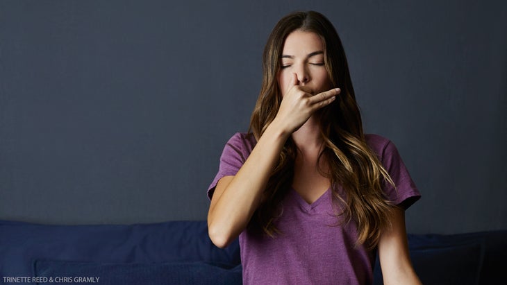 woman doing chandra bhedana moon breath meditation pranayama