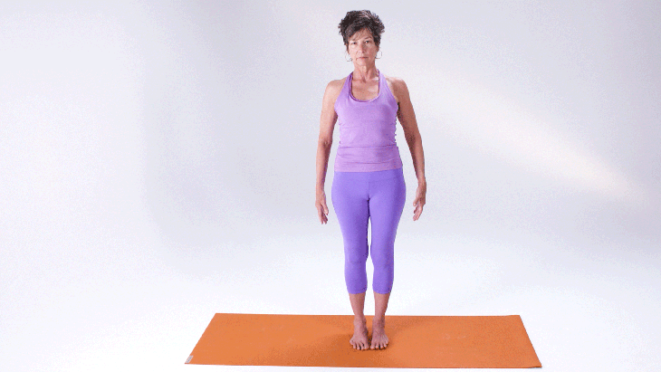 A woman demonstrates Upward Salute