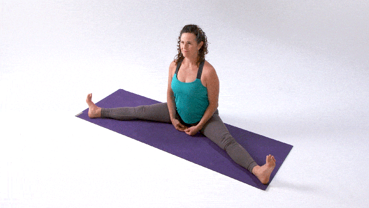 Woman demonstrates Revolved Head-to-Knee Pose