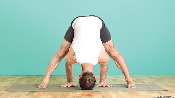 yoga man set up for headstand pose yoga man set up for headstand pose