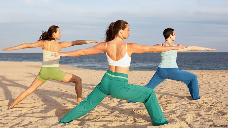 3 women on beach in warrior two 3 women on beach in warrior two