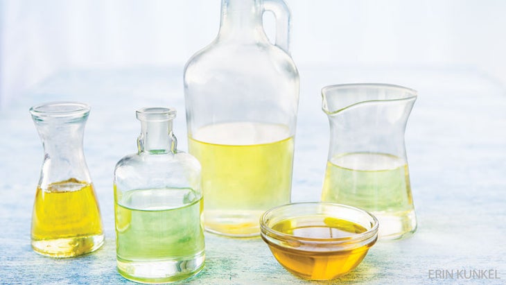 glass jars of olive oil olive oil and ghee nutrients for better health