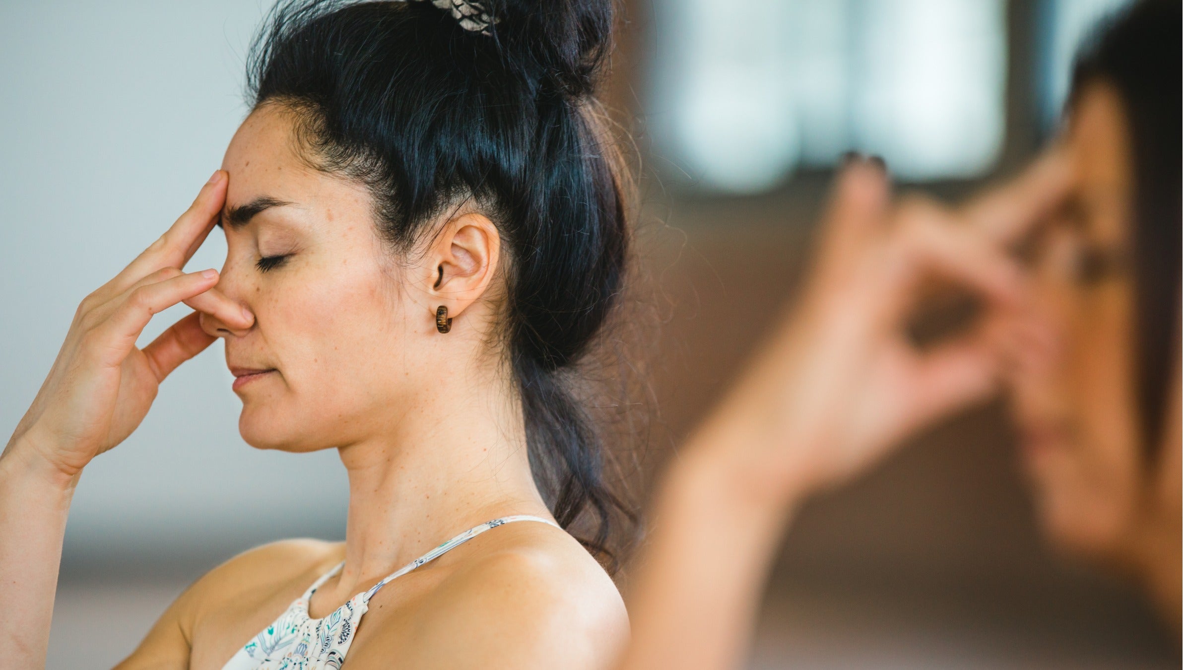 Close up of woman practicing pranayama breath exercises