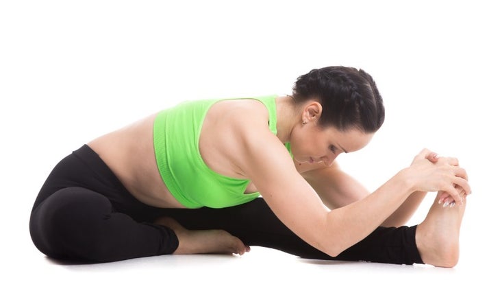 headtoknee-forward-bend-yoga-asana-picture-id471382238 None
