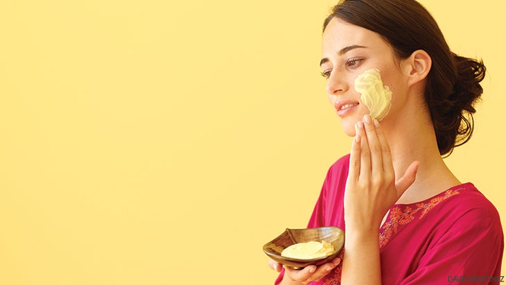 woman rubbing face lotion beauty woman rubbing face lotion beauty