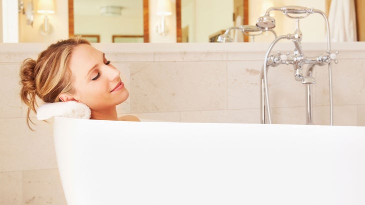 Woman soaking in bathtub woman taking a bath