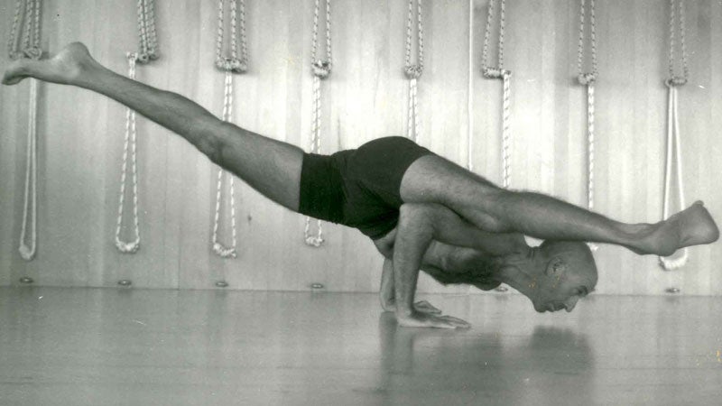 Eddie Modestini practices an arm balance.