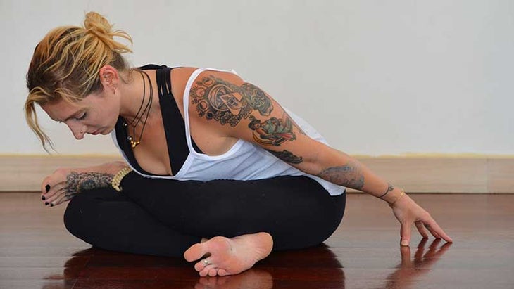 Stefanie Eris in cow face pose, gomukhasana