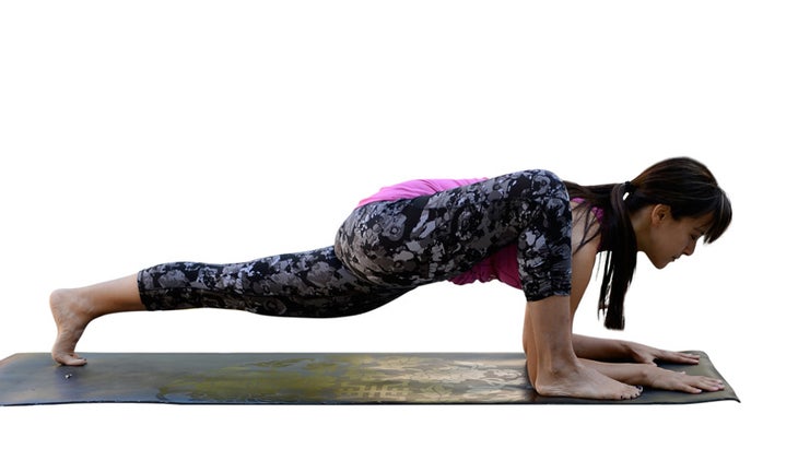 Two Fit Moms perform Lizard Pose.