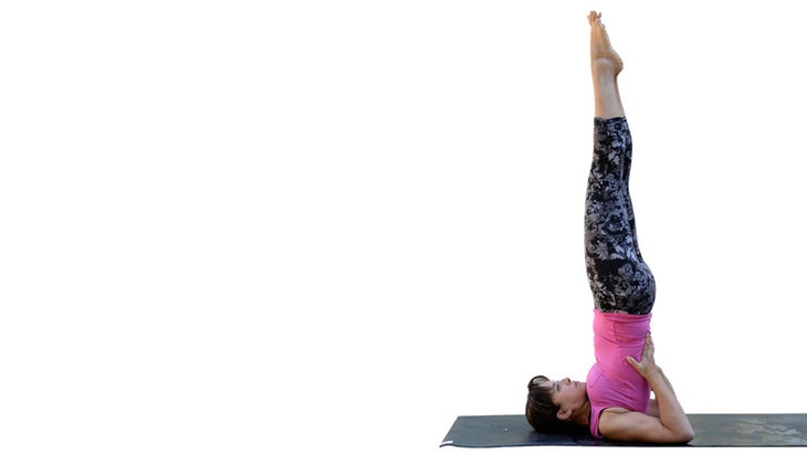 Two Fit Moms perform Shoulderstand. Two Fit Moms perform Shoulderstand.