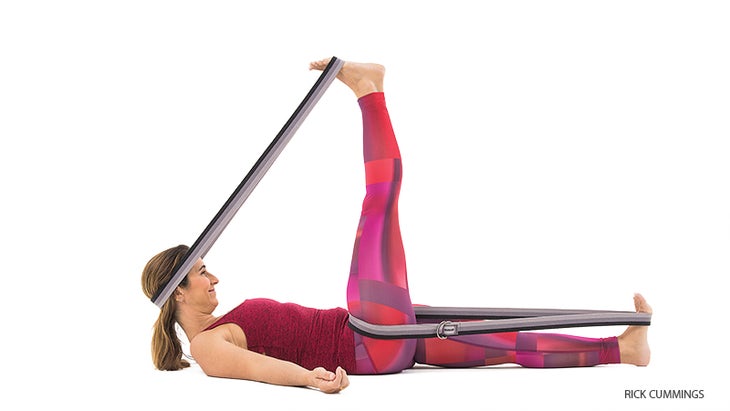 YJ-0121_FNL reclining hand to big toe pose with strap assist, supta padangusthasana