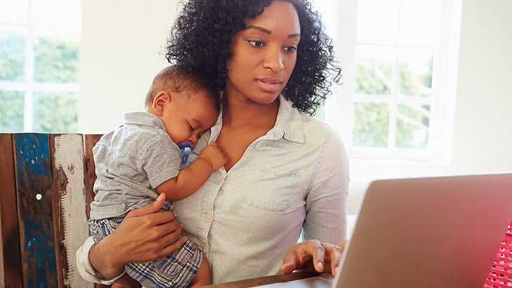 Mother-With-Baby-Working-In-Office-At-Home-000048338332_Medium woman working from home, woman with baby, working mom