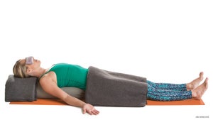 "supported corpse pose
