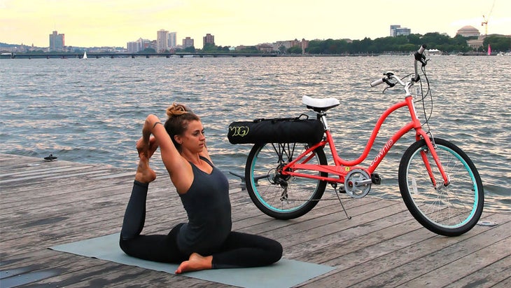 mogi yoga mat pannier girl practicing with bike mogi yoga mat pannier girl practicing with bike