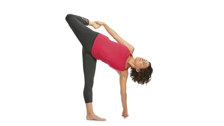 A woman demonstrates Ardha Chandra Chapasana