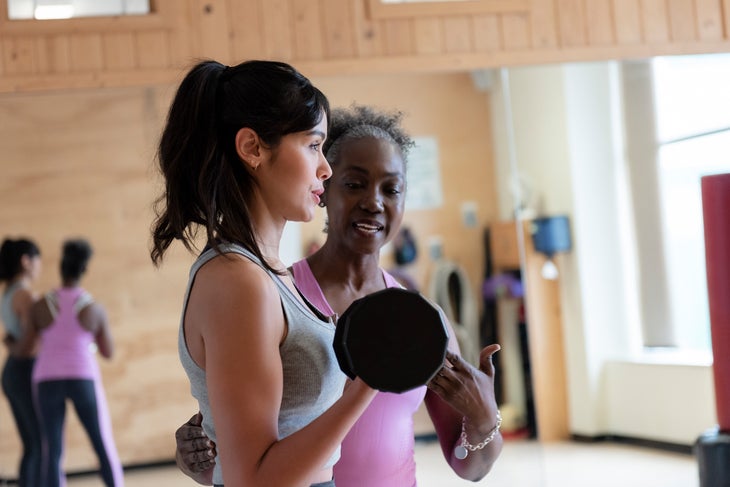 personal trainer teaching form