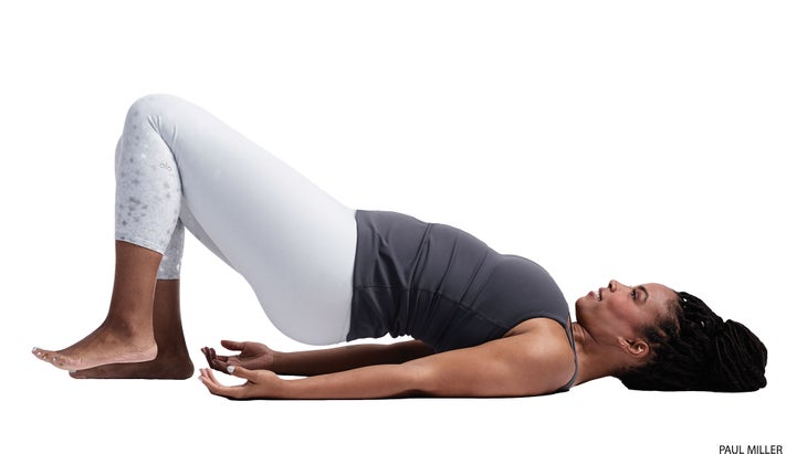 Anatomy_292_36494_cmyk A woman demonstrates a variation of Bridge Pose