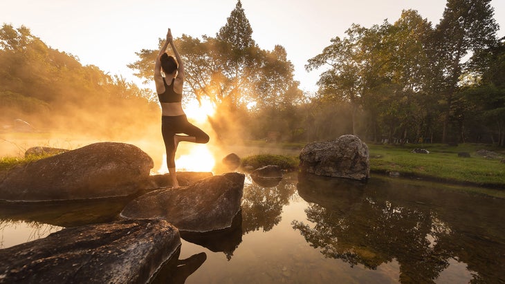 iStock-997496422 Tree pose in nature, morning yoga