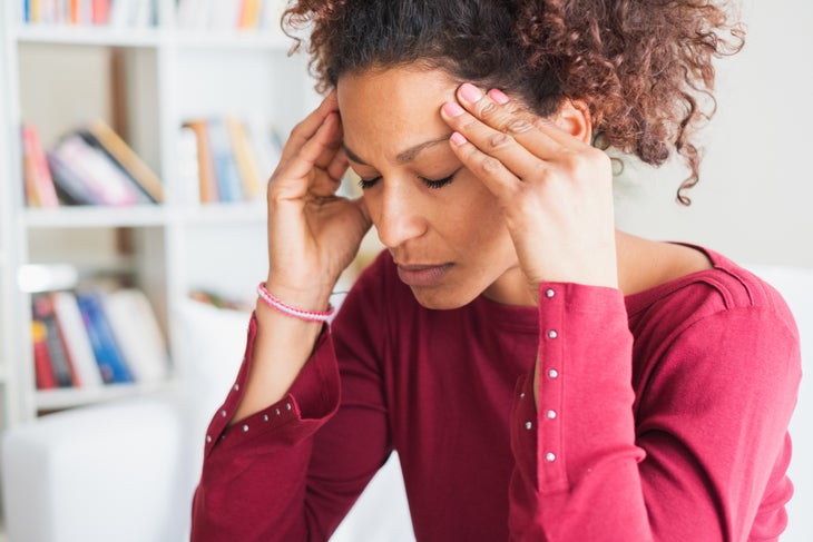 iStock-1054666798 woman with a headache