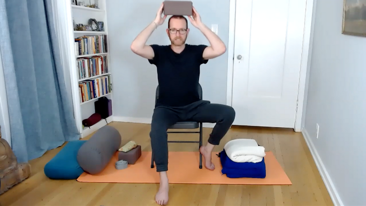 Jivana Heyman teaches Tree Pose variations in a chair