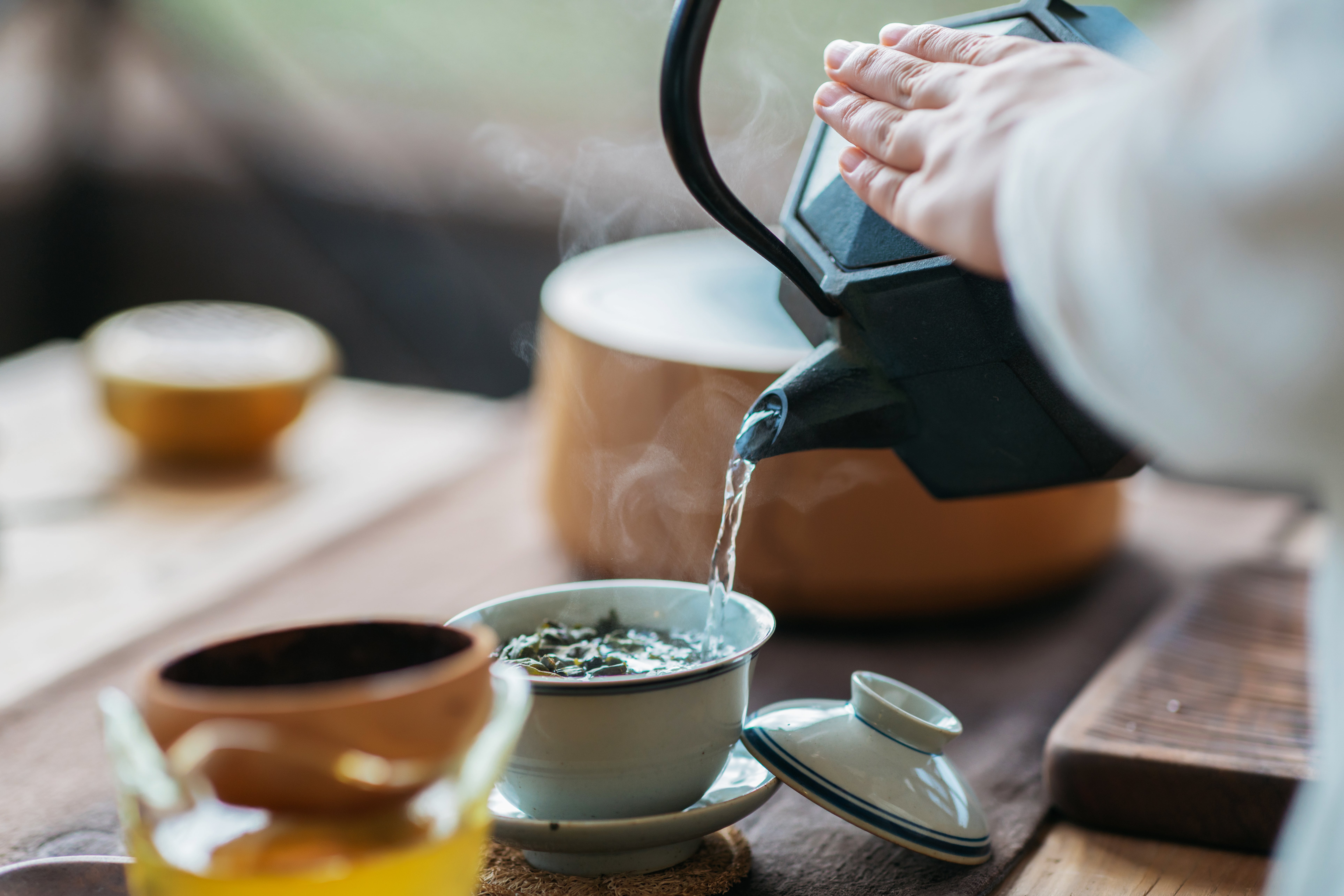 Woman serving Chinese tea in a tea ceremony.