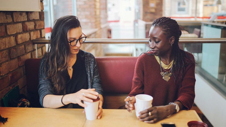friends-support-conversation Friends supporting each other over a cup of coffee